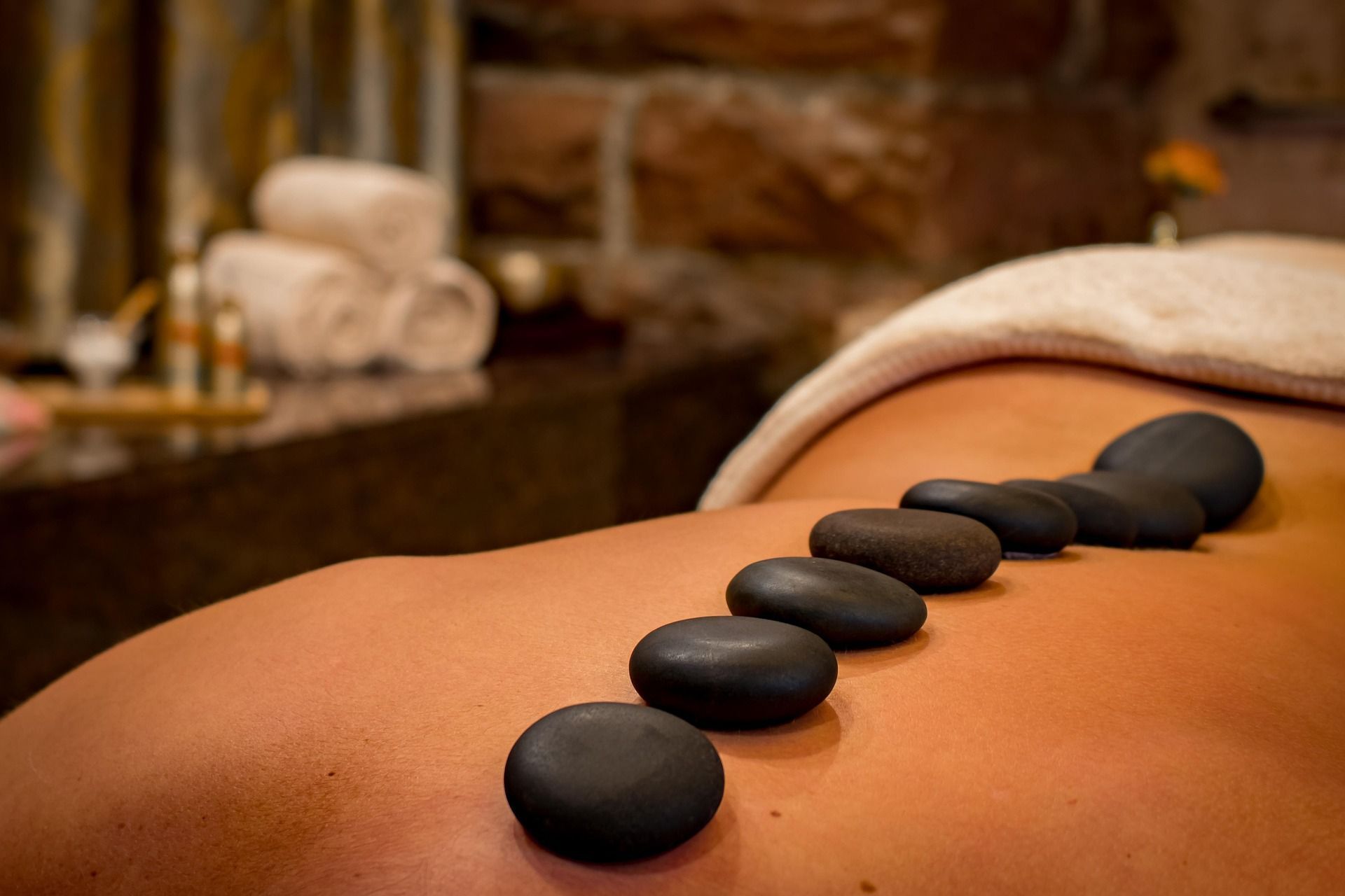 Relaxing hot stone therapy session as part of professional massage services in Tysons Corner VA.